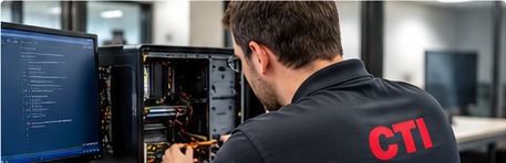 CTI technician working on a computer